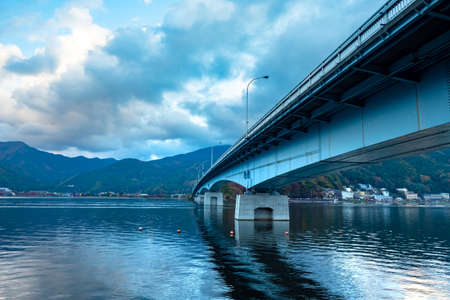 Japan. Bridge across the lake Kawaguchiko. View of the bridge across the lake from below. Large concrete bridge in the city of Fujikawaguchiko. Five lakes of Fuji. Nature of the regions of Japanの写真素材