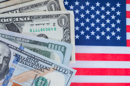 Dollars. Money on the background of the USA flag. Finance Concept - United States Financial Market....