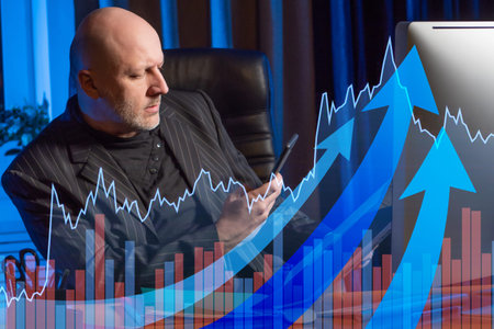CEO at workplace. Head with a phone in his hands. Analysis of financial indicators. Return on...
