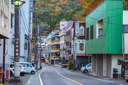 Japan. The road in the city of Fujikawaguchiko. The streets of the Japanese city. A small town near Mount Fuji. Empty car road. Architecture Japan. Buildings in Japanese Provinces. 11.15.2019のeditorial素材