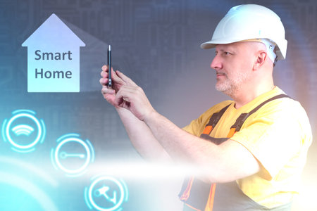 Smart home system installation. Man is installing a smart home technology. Man in uniform next to...