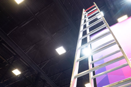 Ladder for construction work, bottom view. Ladder for ancillary work on background of ceiling. She...