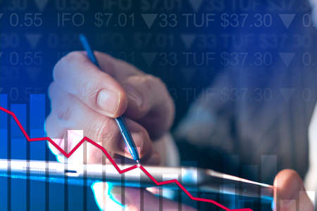 Stock collapse on phone manipulation background. Businessman control stock market direction. Broker buys stocks during fall. Short positions in trading. Manipulating short positions in investmentsの写真素材
