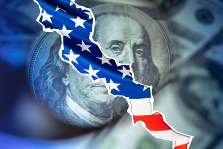 Crack in US dollars. Flag. Stagnation in the economy. Recession in the financial sector. Concept - the financial sector is collapsing. Falling financial markets. The United States Economic Crisisの写真素材