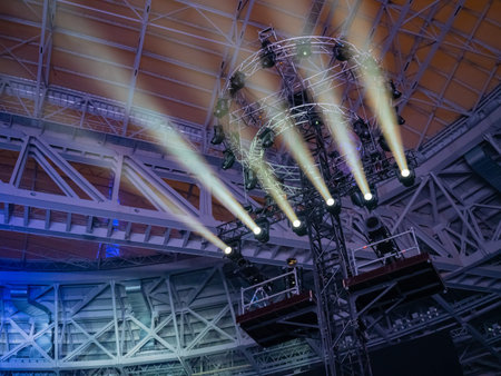 Lighting equipment on a metal stand. Metal scaffolding with lanterns at concert venue. Lighting...