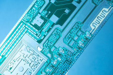 Microboard on a blue background. Fragment of a microboard without copper elements. Computer board...