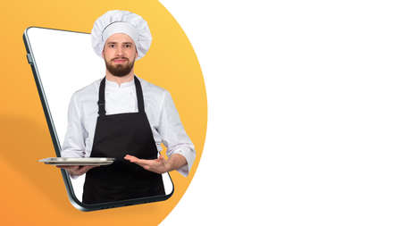 Cafe online. A collage with a chef and a smartphone. Application for ordering lunches and dinners. The chef makes an invitation gesture on the background of a smartphone. Food delivery to your home.の写真素材