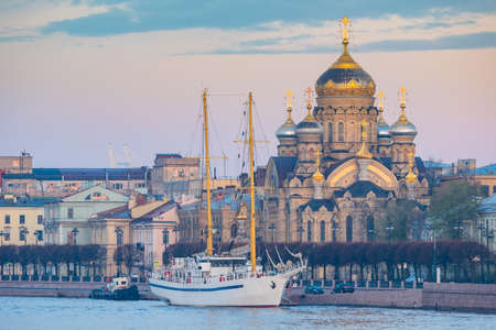 Churches Saint Petersburg. Russia on summer day. Church of Assumption of Holy Mother of God. Assumption Cathedral in Saint Petersburg. Sailing ship off coast of Petrburg. Orthodox Cathedral in Russiaの写真素材
