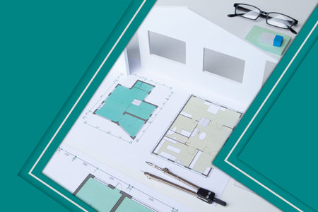 Collage with a construction project. Architect desktop and green background with space for text....