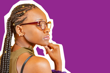 A pensive dark-skinned girl on a purple background. African-American woman reflects. A dark-skinned...