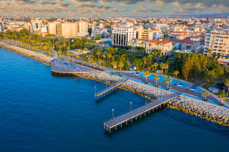 Coast of Republic of Cyprus. Embankment of city of Limassol. Limassol cityscape. Cyprus embankment top view. Marina on banks city in Cyprus. Hotels in Limassol on coast. Mediterranean island travelの写真素材