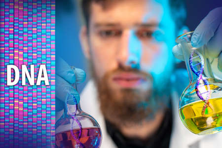 DNA research. The scientist next to the DNA tag. Chromosomal barcodes for biomedical research. Mitochondrial DNA. Biological and medical tests. The study of genetics. Genetic features and pathologies.の写真素材