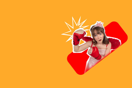 A girl in a crown and boxing gloves. A bright collage with an emotional girl. Achieving goals by any means. A woman with wings and boxing gloves. Space for text on an orange background.の写真素材