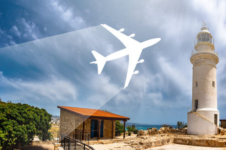Lighthouse on island of Cyprus. Airplane silhouette as a symbol of air travel. White lighthouse in...