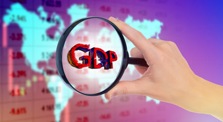 World GDP decline. Global economic crisis. Cracked GDP letters under magnifying glass. Study of economic data. Indicators of economic development. Problems in economics of different countriesの写真素材