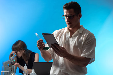 Students in the chemical laboratory. Practical classes in chemistry. A guy and a girl do practical...
