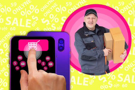 Shopping online. Purchases in the mobile app. Purchase of goods with home delivery. A smartphone with an online store application. Smiling Delivery man. Online business. Mobile application for sales.の写真素材