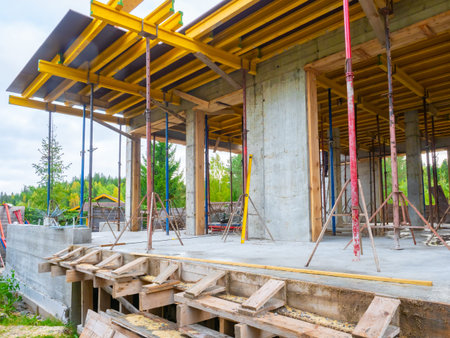 Construction building. Close-up construction site. Unfinished house near the forest. Construction of...