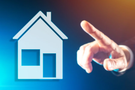 Buying a house, an apartment. Person puts his hand to a schematic image of a house. Purchase of real...