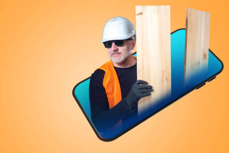 The master, worker, repairman appears from the smartphone. A man with boards on the background of a mobile phone. Calling the wizard. Mobile application. A collage in the magazine style.の写真素材