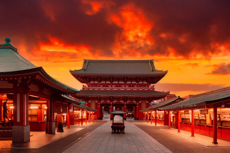 Japan, Tokyo. Asakusa Temple in red. Sensoji Temple under red sky. Buddhism concept. Buddhist temple without people. Asakusa Street with souvenir shops. Hand washing bowl in front of Buddhist templeのeditorial素材