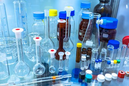 Empty laboratory glassware. laboratory glassware on a glass shelf. Various glass test tubes. Test...