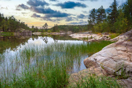 Nature of Karelia. Northern Russia. Ladoga lake. Small lake in Karelia. Northern nature of Karelia. Landscape of nature of Petrozavodsk. Landscape of Russia. Traveling to regions of Russia.の写真素材
