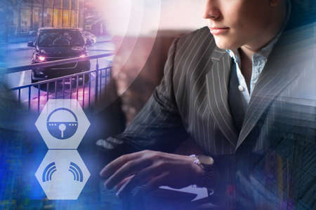 Remote control car concept. Man controls locks of automobile through computer. It controls smart car via internet. Smart car symbols next to man. Automobile is equipped with modern smart electronicsの写真素材