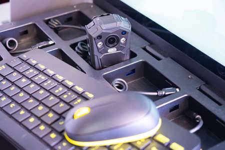 Computer mouse and keyboard next to DVR. Breast DVR within charging station. Concept - video recorder with internet control function. Keypad as a symbol for remote control of recorder.の写真素材