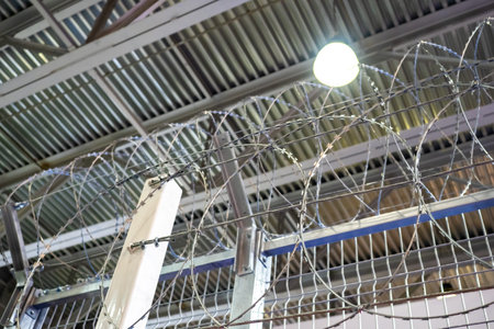 Barbed wire border. Barbed wire under hangar roof. Barbed wire for protection against intrusion....