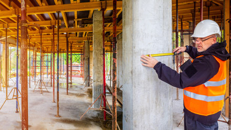 Construction monitoring. The engineer controls the quality of the work. Construction foreman with a...
