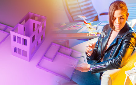 Layout of multi-storey building near designer. Concept - architectural design. Woman is thinking...