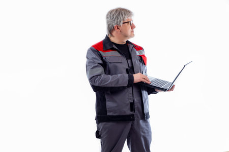 Adult computer technician. Gray-haired computer technician with laptop. She works as engineer or...