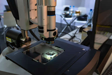 Modern electron microscope close-up. Microscope in the laboratory. Concept - equipment for scientific research. Fragment of a microscope. Enlarged image acquisition equipment.の写真素材