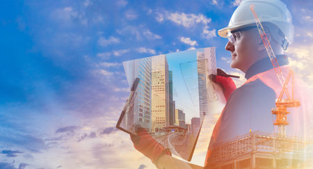 Builder worker with papers in hand. builder worker on sky background. Portrait of an engineer in...