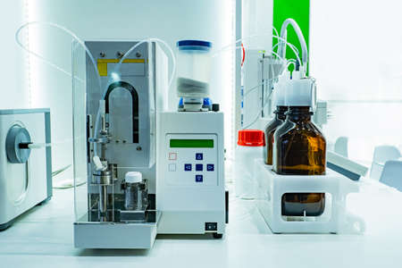 Drug production. Encapsulator on a laboratory bench. Encapsulation equipment. Sale of equipment for production of drugs. Device for making medicines. Manufacturing of medicines. Encapsulator in labの写真素材