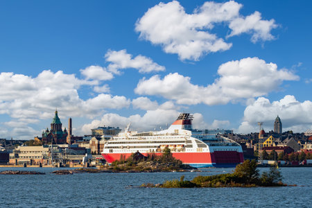 Helsinki. Finland. A cruise liner in the harbor of Helsinki. Baltic sea. Gulf of Finland. The big ship is heading for the dock. Assumption Cathedral in Helsinki. Cruises on the liner.の写真素材