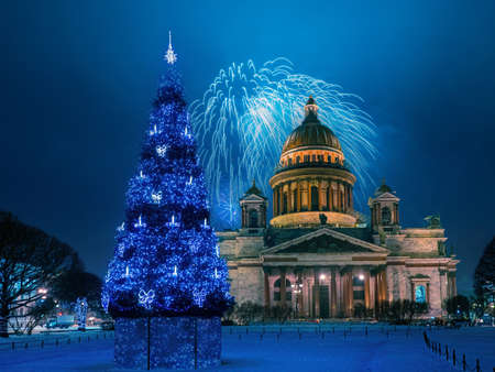 Saint Petersburg festival. Russia fireworks. Isaac's Cathedral. Fireworks over St. Isaac's Cathedral. Christmas salute in Saint Petersburg. New Year's tree on St. Isaac's Square. Russia winter nightの写真素材