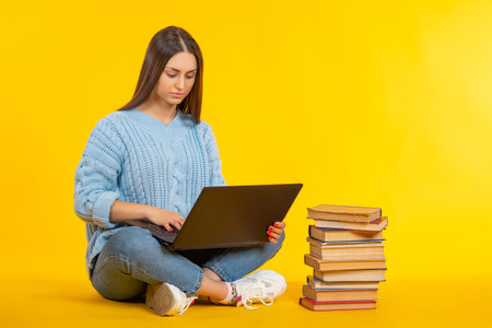 Female student with laptop on her lap. College student sportsret. Girl student in casual clothes....