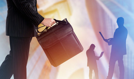 Confident businessman with business briefcase. Illustration of a business career. Double exposure of businessmen near business center. Businessman career. Concept - community of businessmen.の写真素材