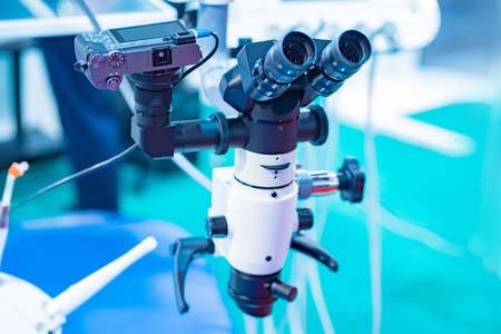 Microscope. Work as a dentist. Microscope for the orthodontist. Work under the microscope. Sale of dental equipment. Medecine. Equipment for operations on the jaw. Medical service. Surgery.の写真素材