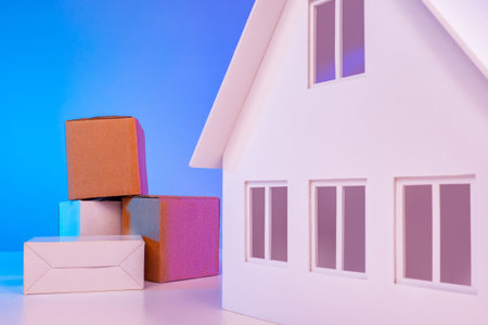 Carriage of household items. Door-to-door furniture transportation. Boxes of furniture are near the house.Concept Furniture for home delivery.Transport company.Boxes of different sizes near the house.の写真素材