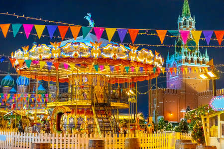 Russia. Carousel on the Red Square in Moscow.Playground on the Red Square. Children's attraction decorated for Christmas.New Year celebrations in Moscow.Christmas atractions in the Russian Federation.の写真素材