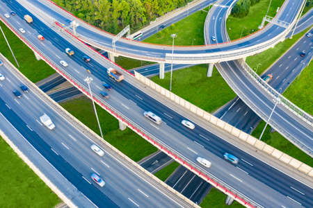 Freeway. Road junction. Speedway view from above. Road architecture. Road construction. Highway. Cars ride on a fast driveway. Freeway top view. The driveway for cars from a bird's eye view.の写真素材