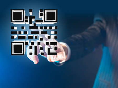 Three-dimensional QR code on a virtual screen. Person puts his hand to the QR code. Bar code about vaccination. Matrix QR on black background. Quick Response code. A new reality. 3d imageの写真素材
