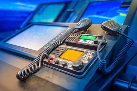 Work with a radio station. Providing communication. Radio station at the enterprise. Professional radio stations. The wireless station on the ship. Radiocommunication.の写真素材