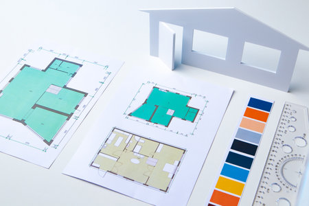 Architectural company. Architect's desk. Design of the building. Floor plan. Architect is working on a building design. Exact copy of the future home. Layout of the rooms. Reconstruction of premisesの写真素材