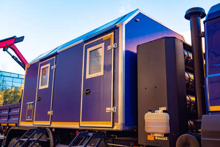 Container-type mobile buildings. Mobile buildings on wheels. Modular residential cars. Change house. Truck with a trailer. House on wheels. Change house on a truck. Special vehicles.の写真素材