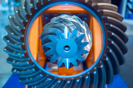 Milling machine. Background with metallic details. Gears. Bevel gears. Concept - metalworking. Differential. Concept - Development of industrial equipment. Industry. Industrial backgroundの写真素材