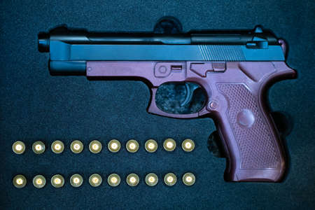 The gun in the case. Firearms. Case for the gun. Storage of firearms. Suitcase for a pistol close-up. Concept - weapons collection. Case with a compartment for the gun. Caliber. Pistol purchaseの写真素材